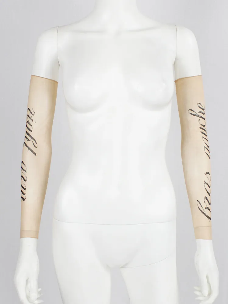 Ann Demeulemeester sheer sleeve with cursive “Bras Gauche” lettering — spring 1998