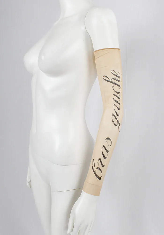 Ann Demeulemeester sheer sleeve with cursive “Bras Gauche” lettering — spring 1998