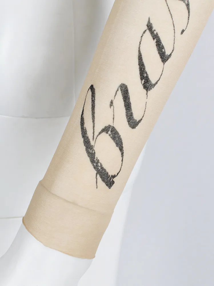 Ann Demeulemeester sheer sleeve with cursive “Bras Gauche” lettering — spring 1998