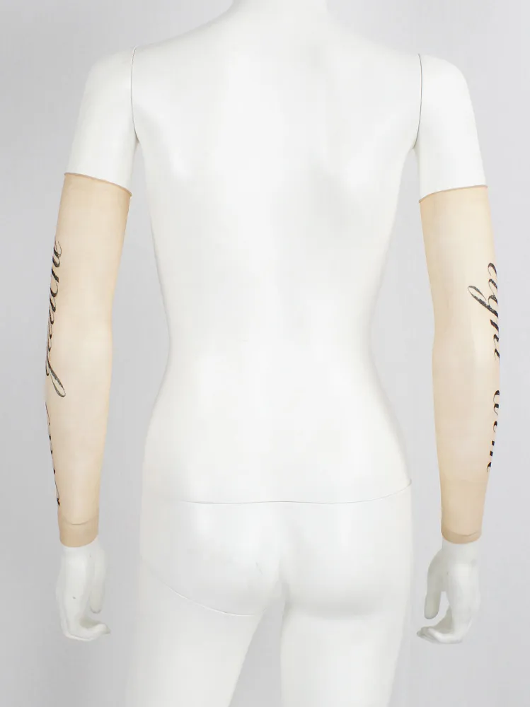 Ann Demeulemeester sheer sleeve with cursive “Bras Gauche” lettering — spring 1998